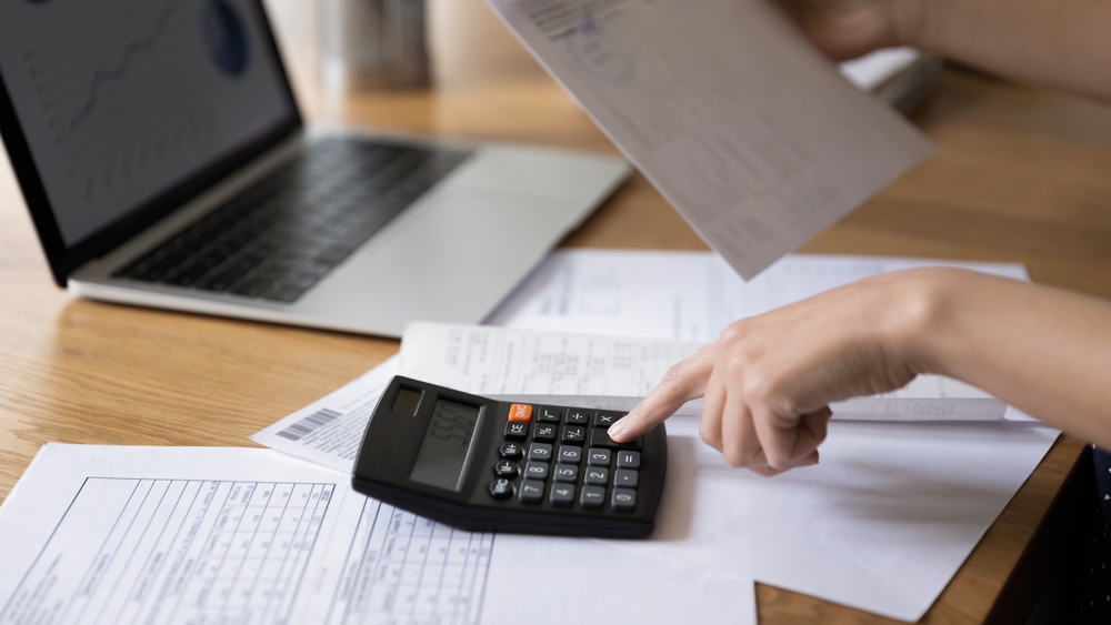 Homeowner applying financial management tips for smart preparation.